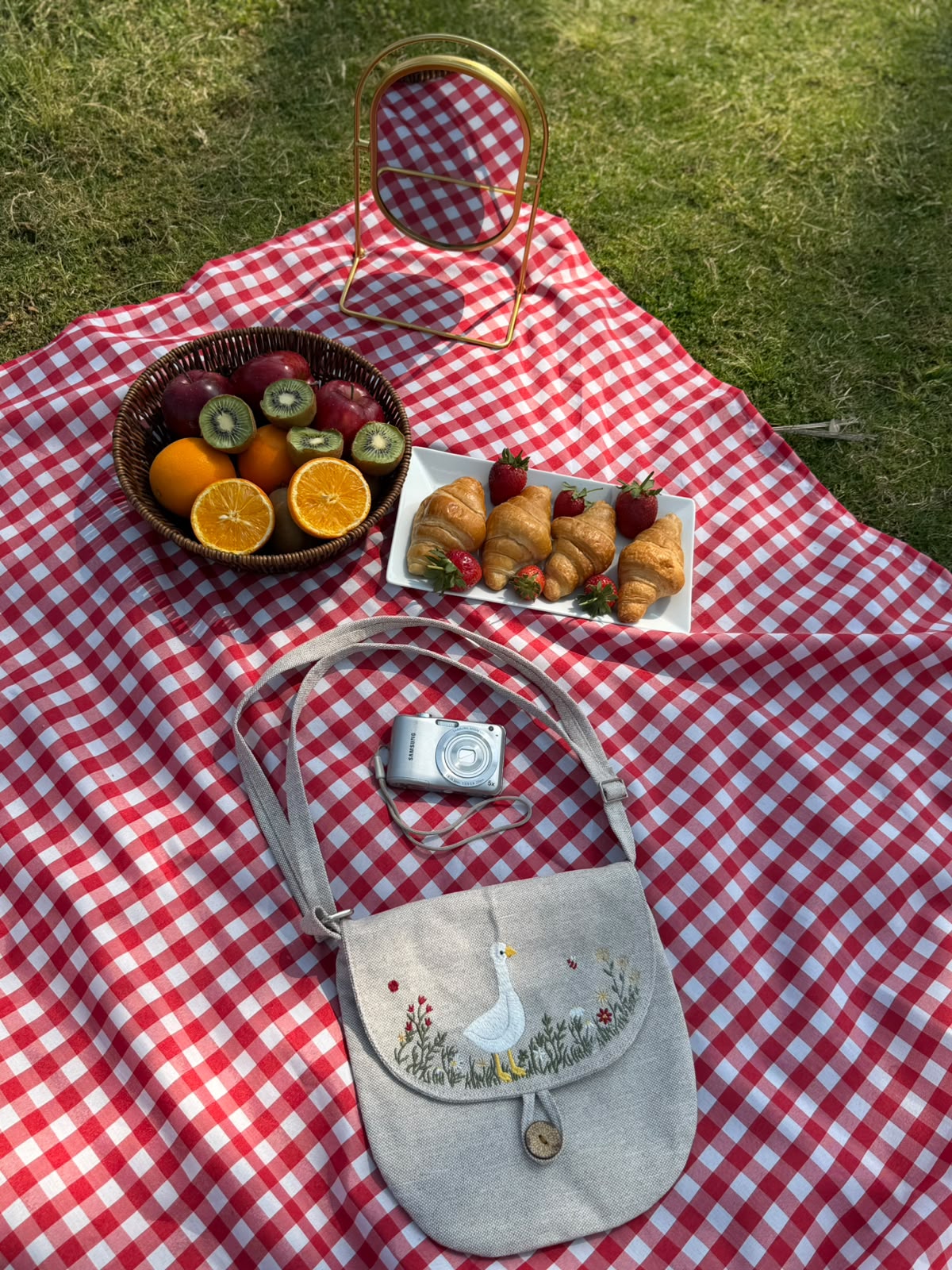Grey linen crossbody bag embroidered with a goose and wildflowers