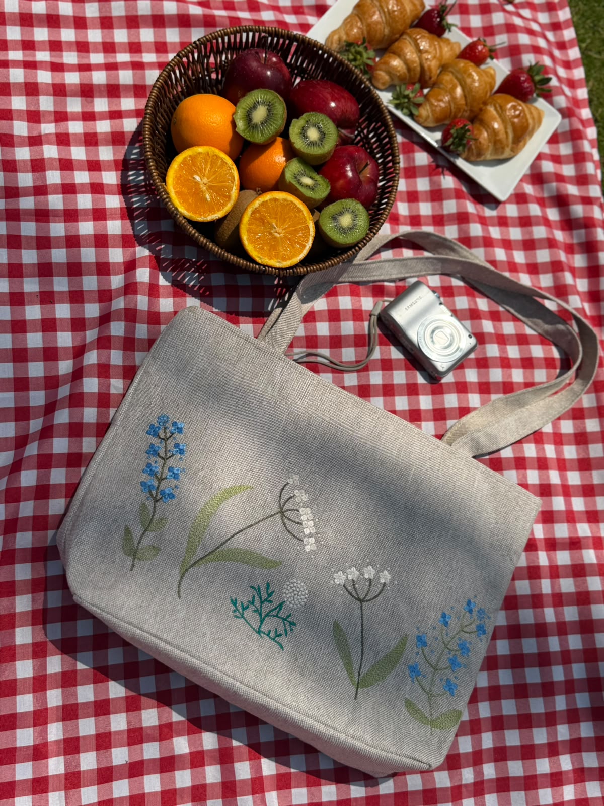 Oat linen tote bag embroidered with blue and cream wildflowers
