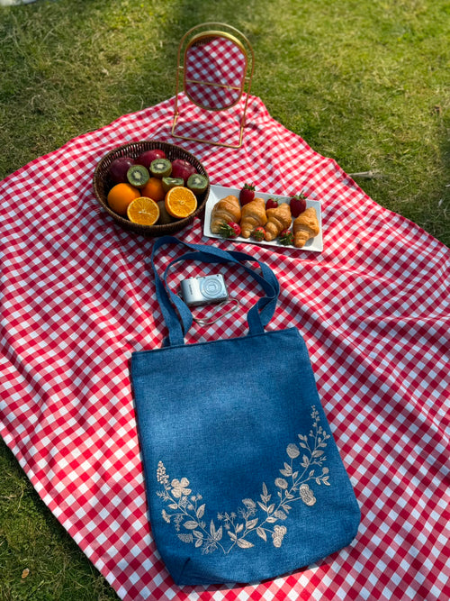Denim blue tote bag with cream floral embroidery